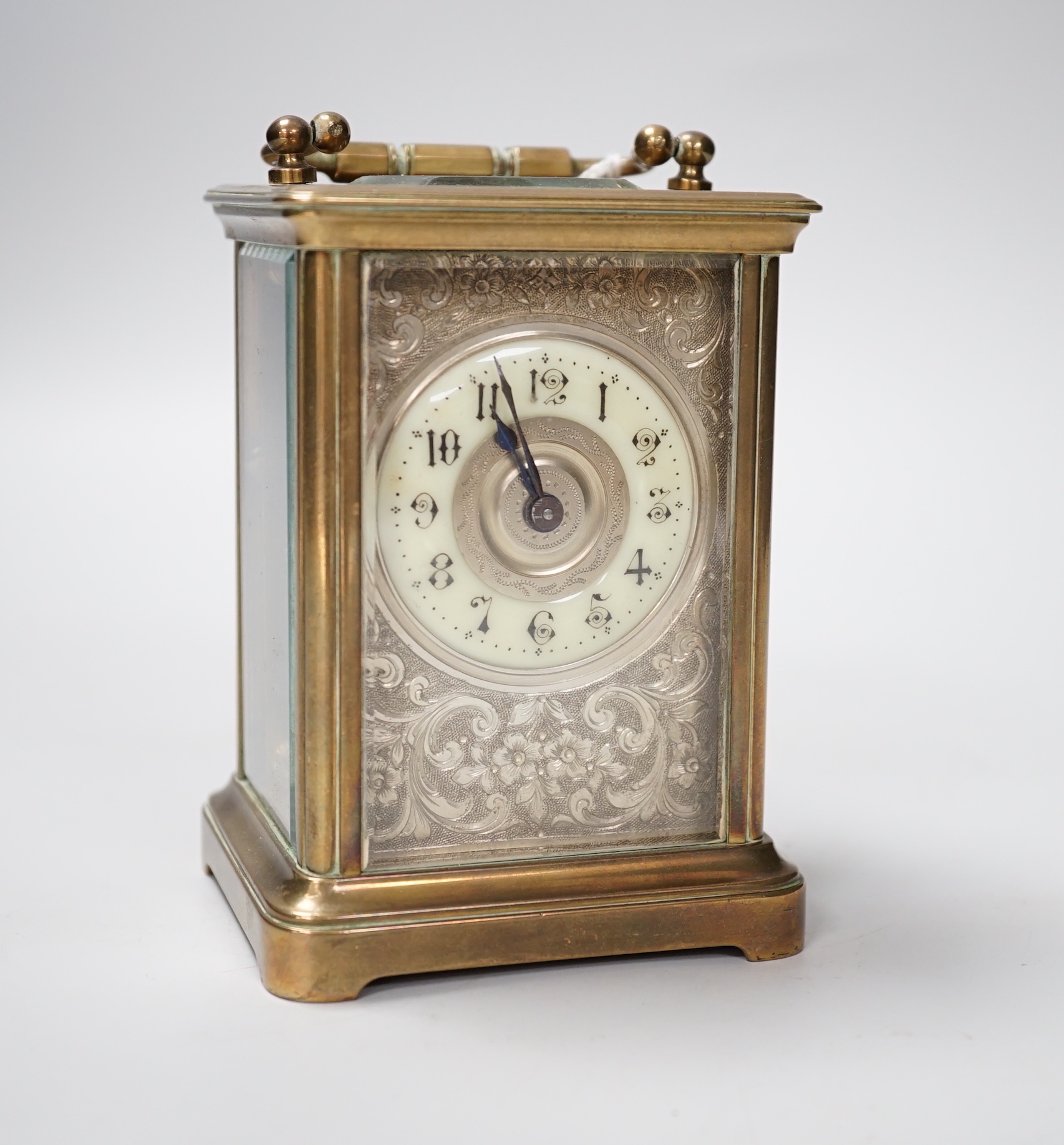 A French brass cased timepiece with silvered and enamelled dial, 12cm tall